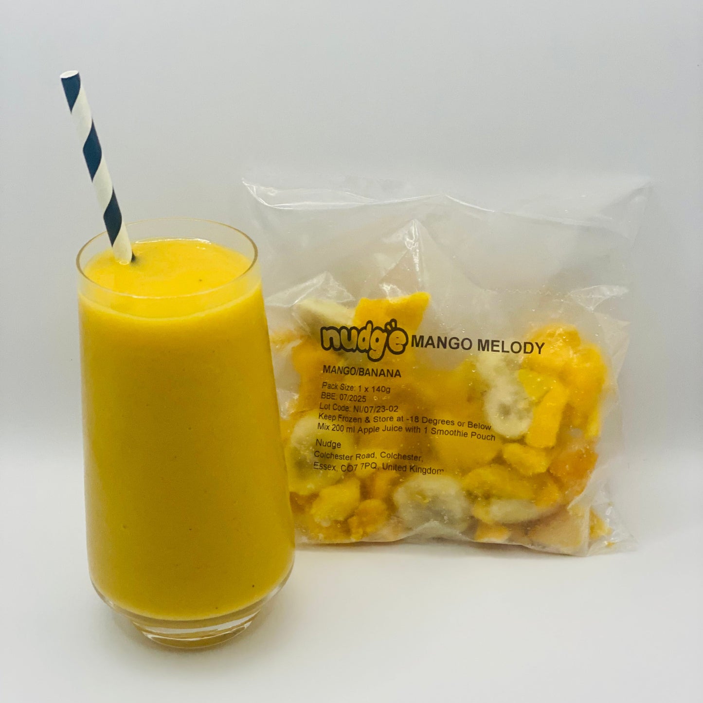 Nudge mango melody frozen smoothie in glass with 140 gram sachet of mango and banana